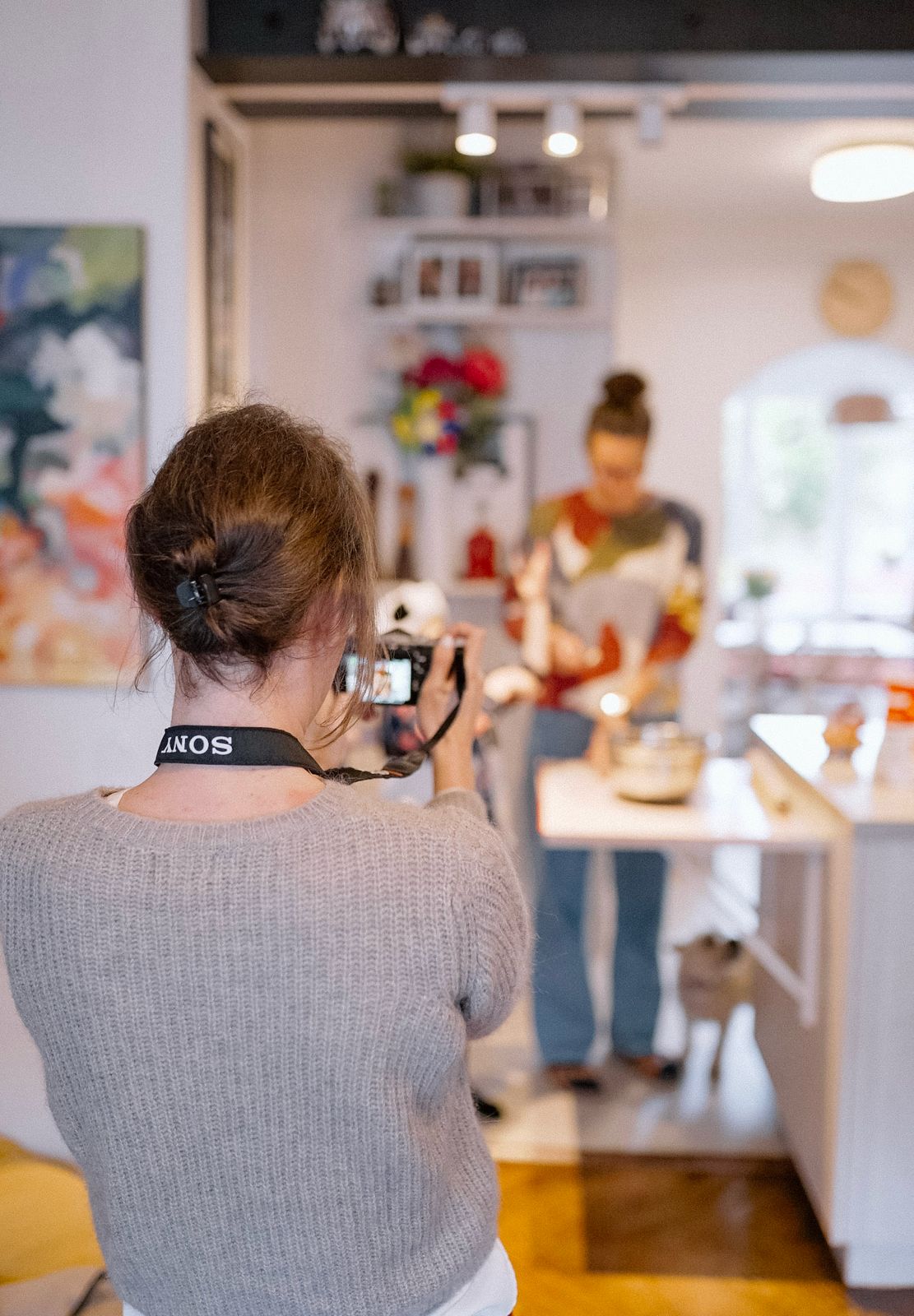 Julie filming a family at home